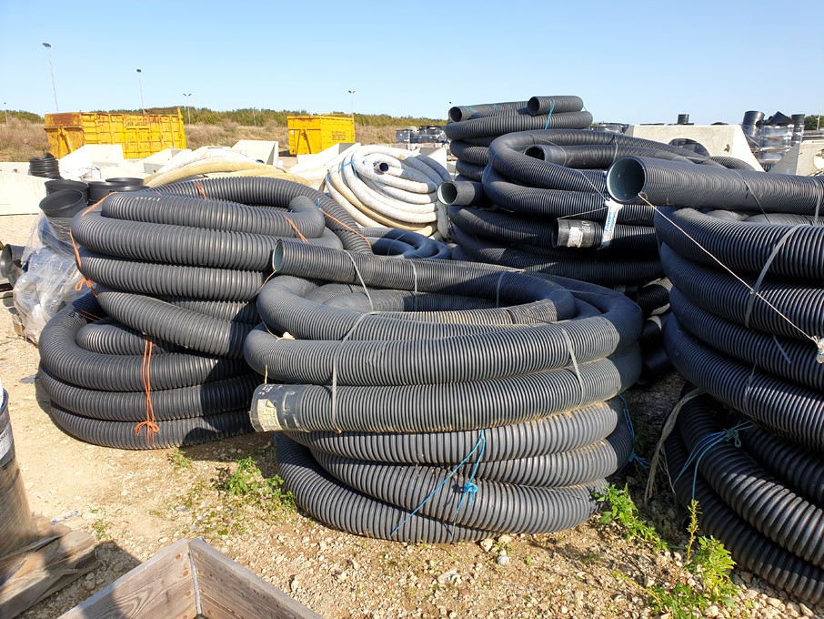 Qty Ridgicoil black electric ducting on 4 pallets