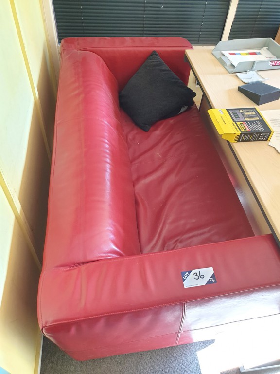 Red leather effect 2 seater sofa, 1800mm approx wi...