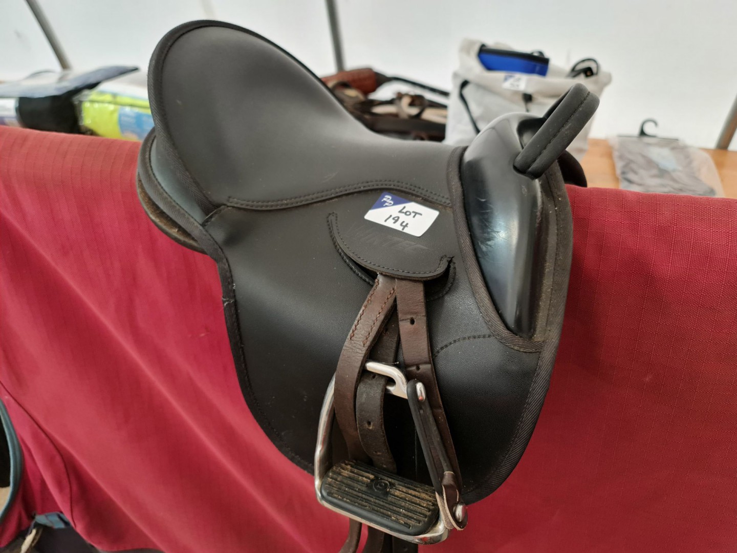 Wintec synthetic pony saddle with leathers, stirru...