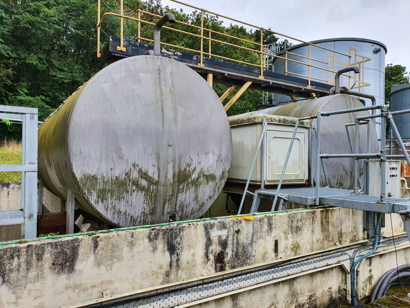 Steel horizontal oil storage tank in bund, 2.4m di...