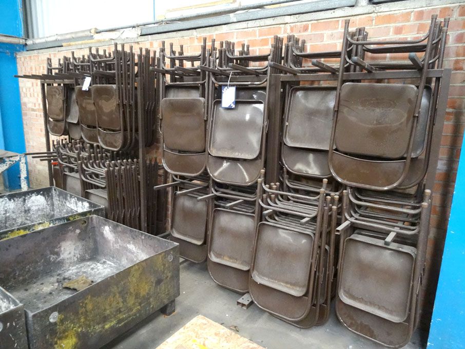 50 approx brown metal fold up chairs on 2x trolley...