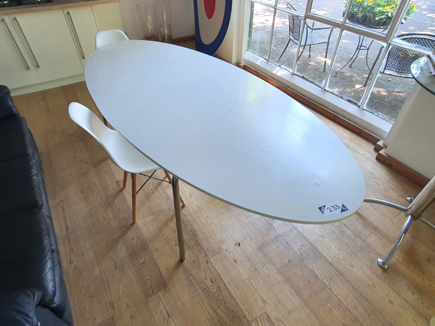 White oval kitchen table, 2400x1020mm with 2x whit...