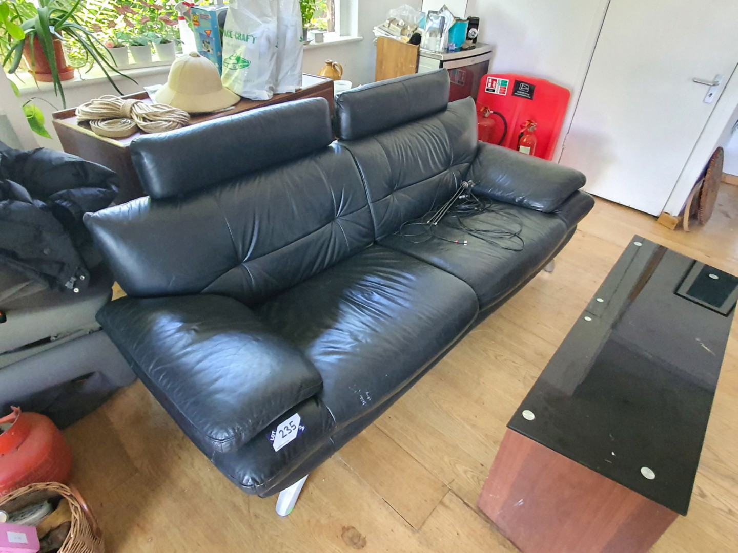 Black leather effect 2 seater sofa (broken foot)