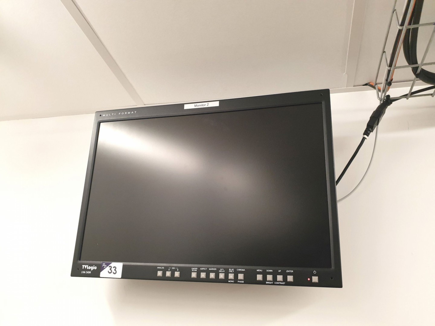 TV Logic LVM-240W multi format LCD monitor on wall...
