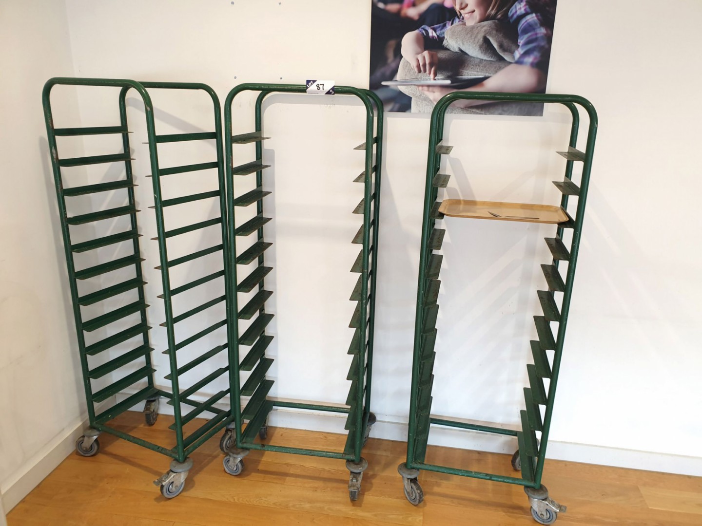 3x green metal mobile tray trolleys