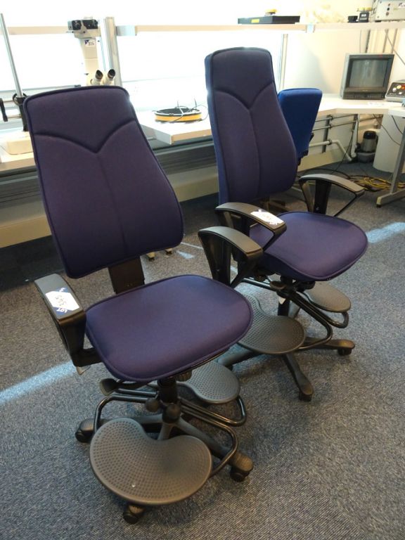 2x Kinnarps purple upholstered swivel chairs with...