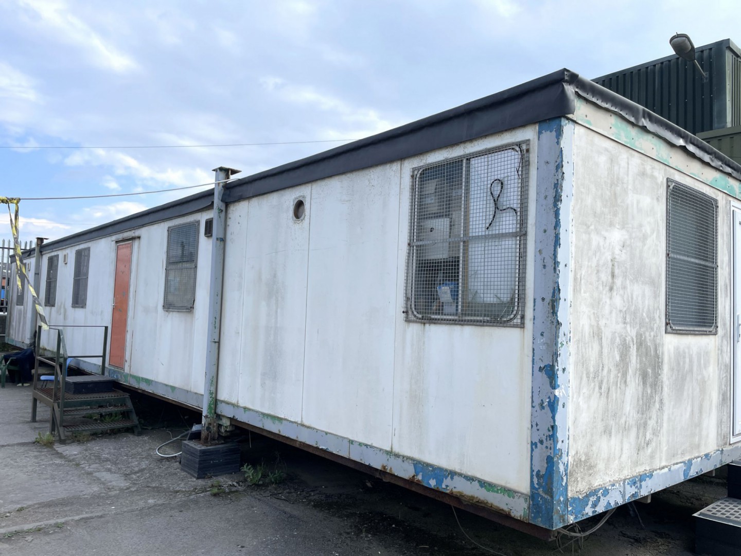 Metal frame jack legged cabin, 45x11ft (approx), i...